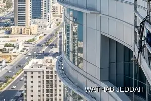 Wathab Jeddah team performing Glass Facade Cleaning in Al Faisaliyah, Jeddah