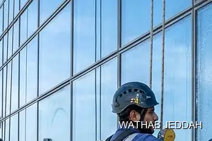 Wathab Jeddah team performing Glass Facade Cleaning in Al Nazlah Al Sharqiyah, Jeddah