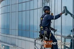 Wathab Jeddah team performing Glass Facade Cleaning in Al Rawdah, Jeddah